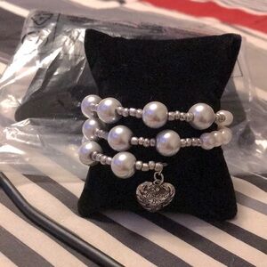Elegant Silver wrap Pearl Bracelet.  Charm says Listen to your heart.